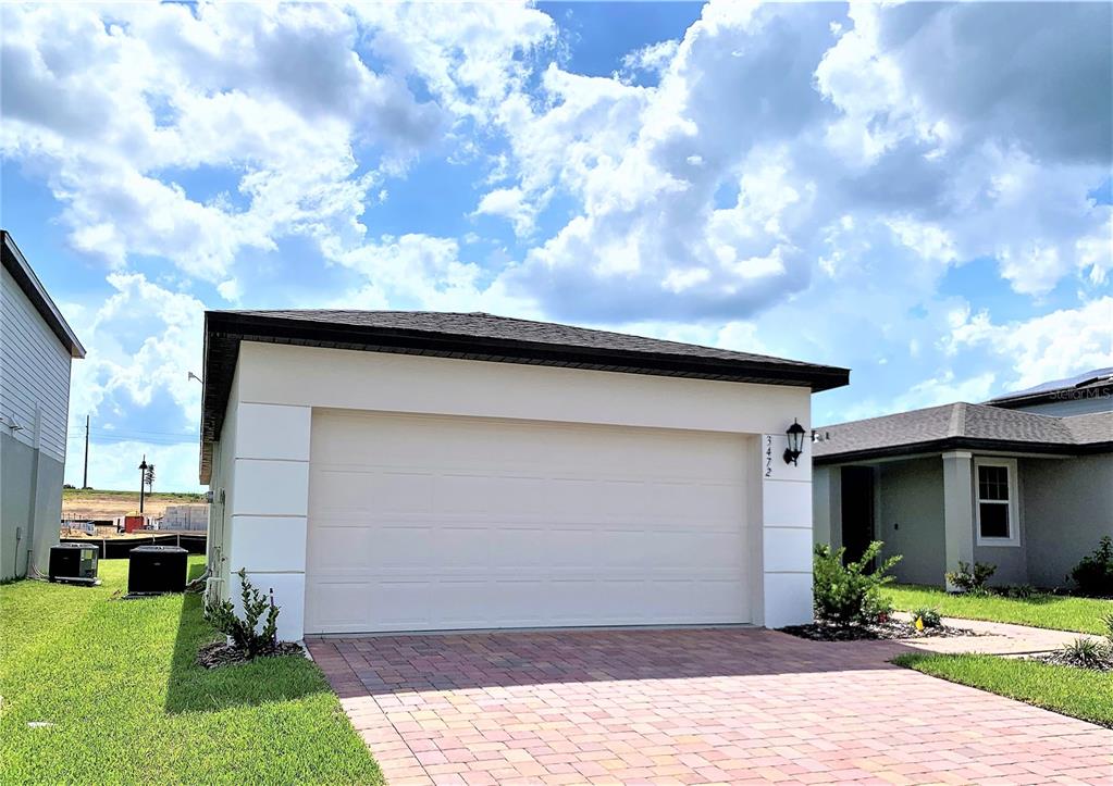3472 Monaco Drive Davenport, FL 33897 - Photo 3 of 25 a front view of a house with a yard