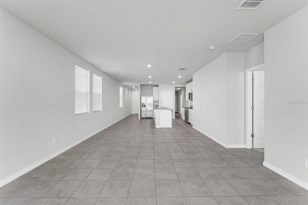 3472 Monaco Drive Davenport, FL 33897 - Photo 7 of 25 a view of a big room with closet and windows