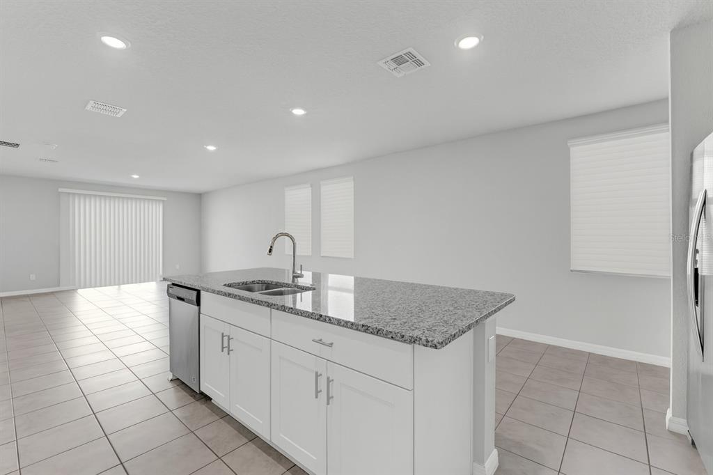 3472 Monaco Drive Davenport, FL 33897 - Photo 10 of 25 a kitchen with a sink and cabinets