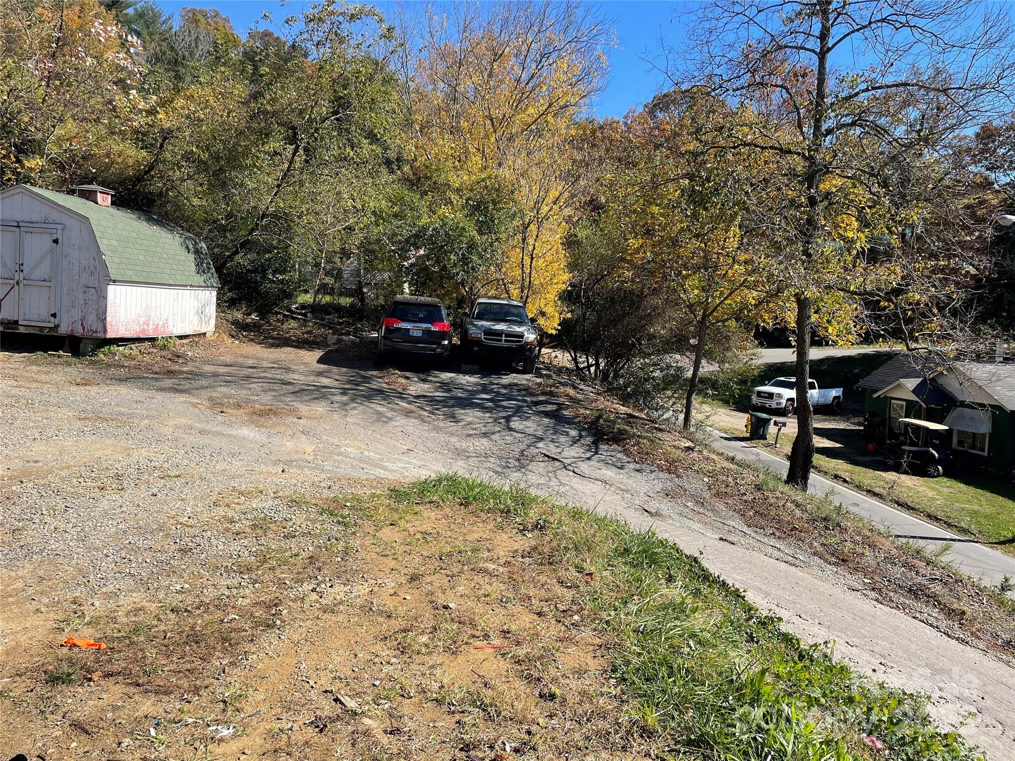 131 Lookout Road Asheville, NC 28804 - Photo 7 of 10 a view of a backyard with table and chairs and a large tree