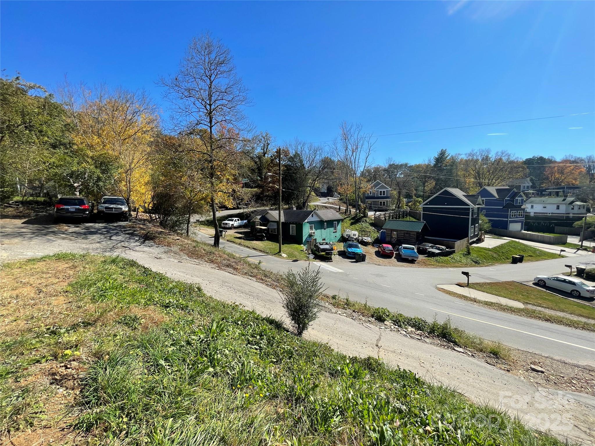 131 Lookout Road Asheville, NC 28804 - Photo 9 of 10 a view of a swimming pool with a yard and mountain view