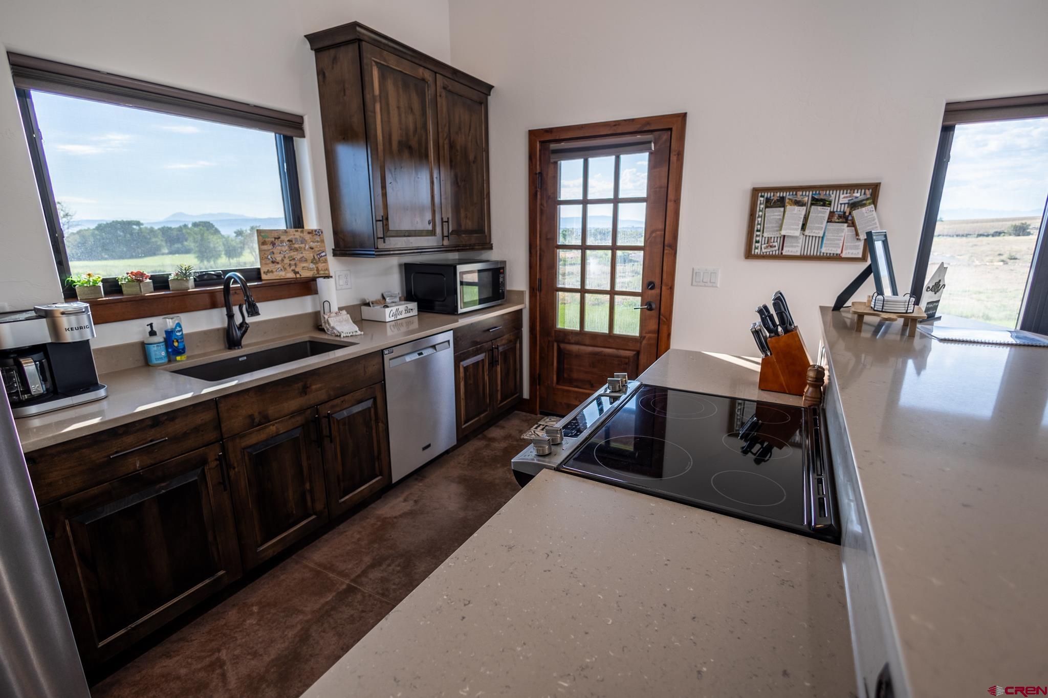 53520 Falcon Road Olathe, CO 81425 - Photo 30 of 35 a kitchen with a sink appliances and a window