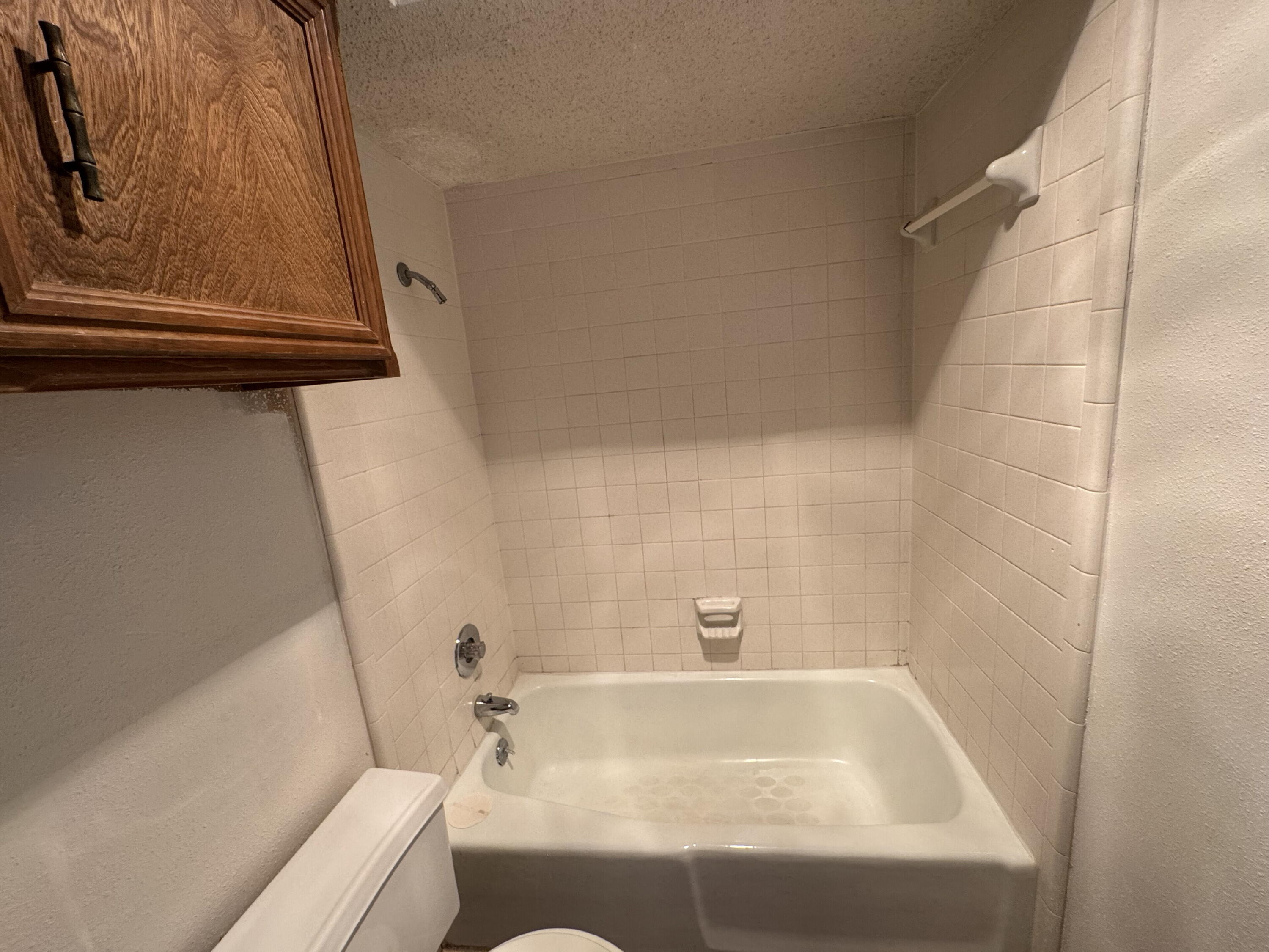 7403 Utica Avenue, Unit B Lubbock, TX 79424 - Photo 9 of 9 a bathroom with a bathtub
