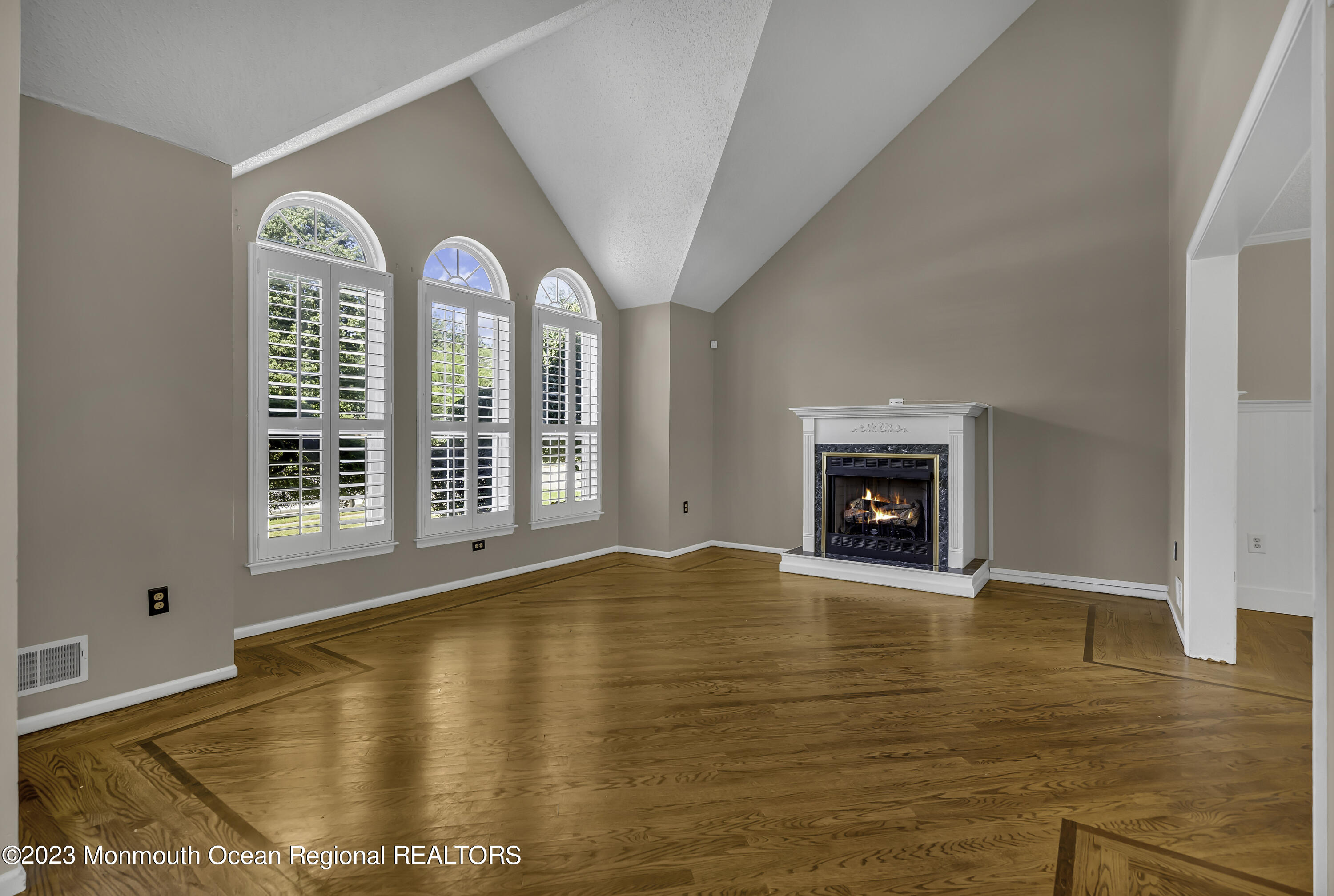 244 Down Hill Run Toms River, NJ 08755 - Photo 12 of 44 a view of an empty room with window and fire place