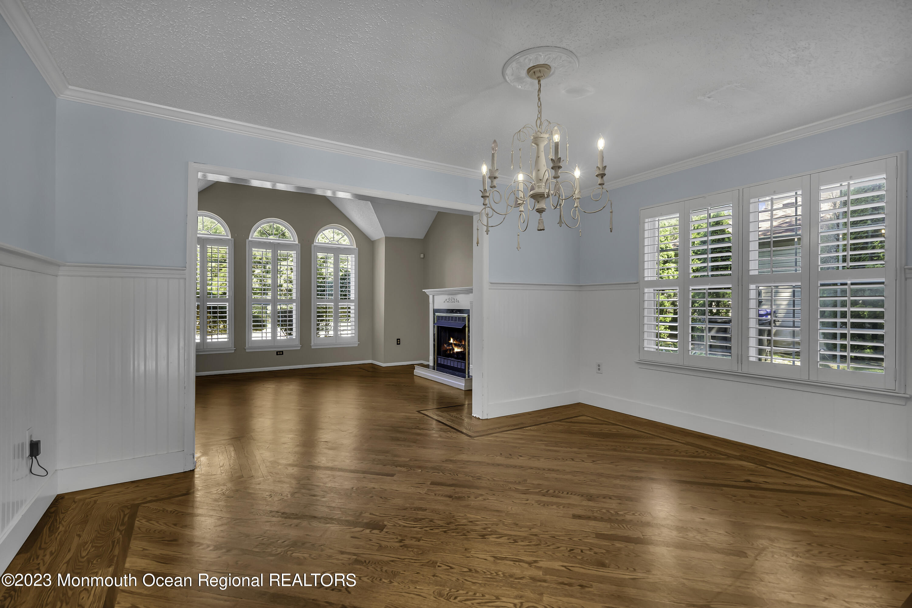 244 Down Hill Run Toms River, NJ 08755 - Photo 15 of 44 a view of a big room with wooden floor windows and chandelier