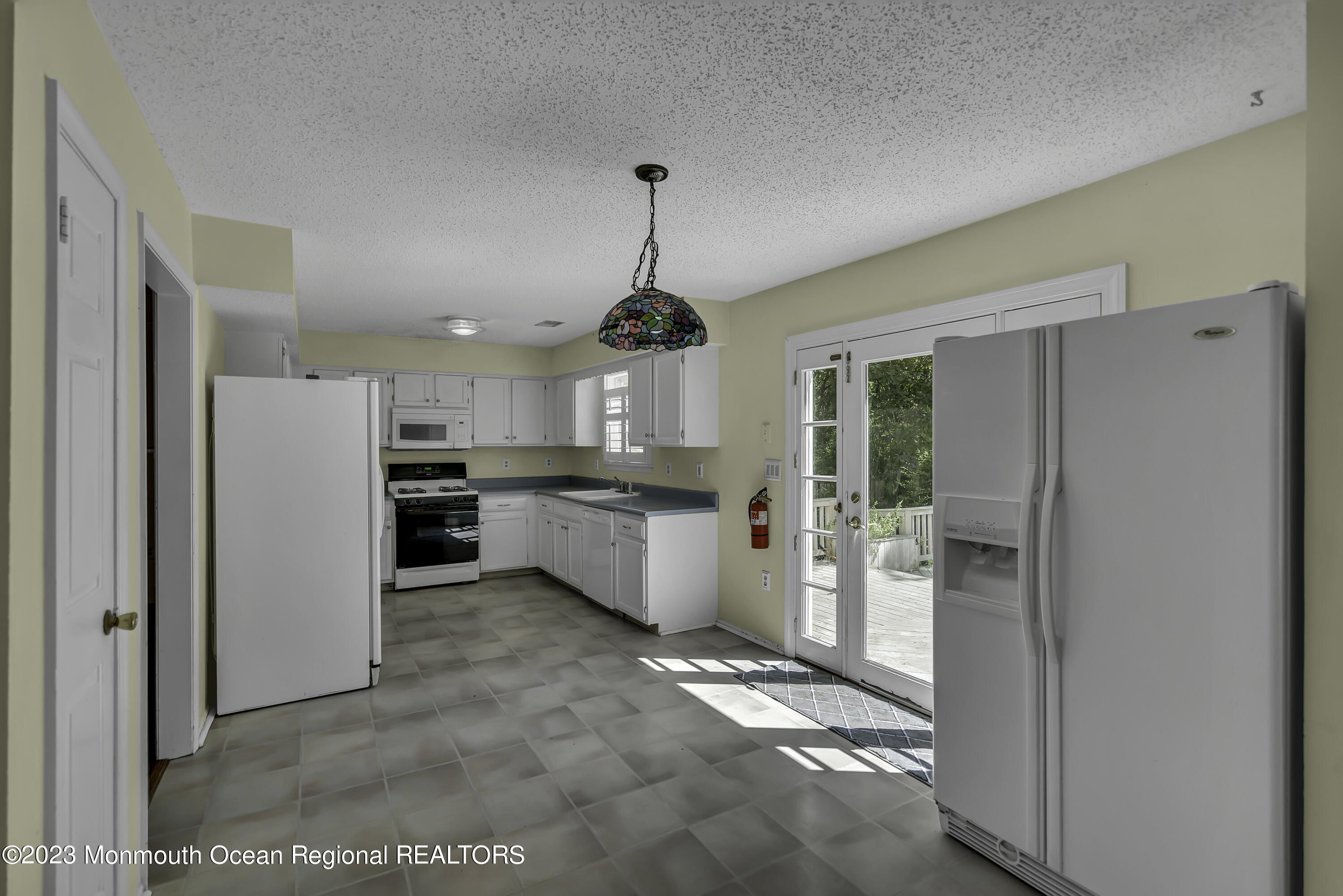 244 Down Hill Run Toms River, NJ 08755 - Photo 21 of 44 a kitchen with refrigerator and cabinets