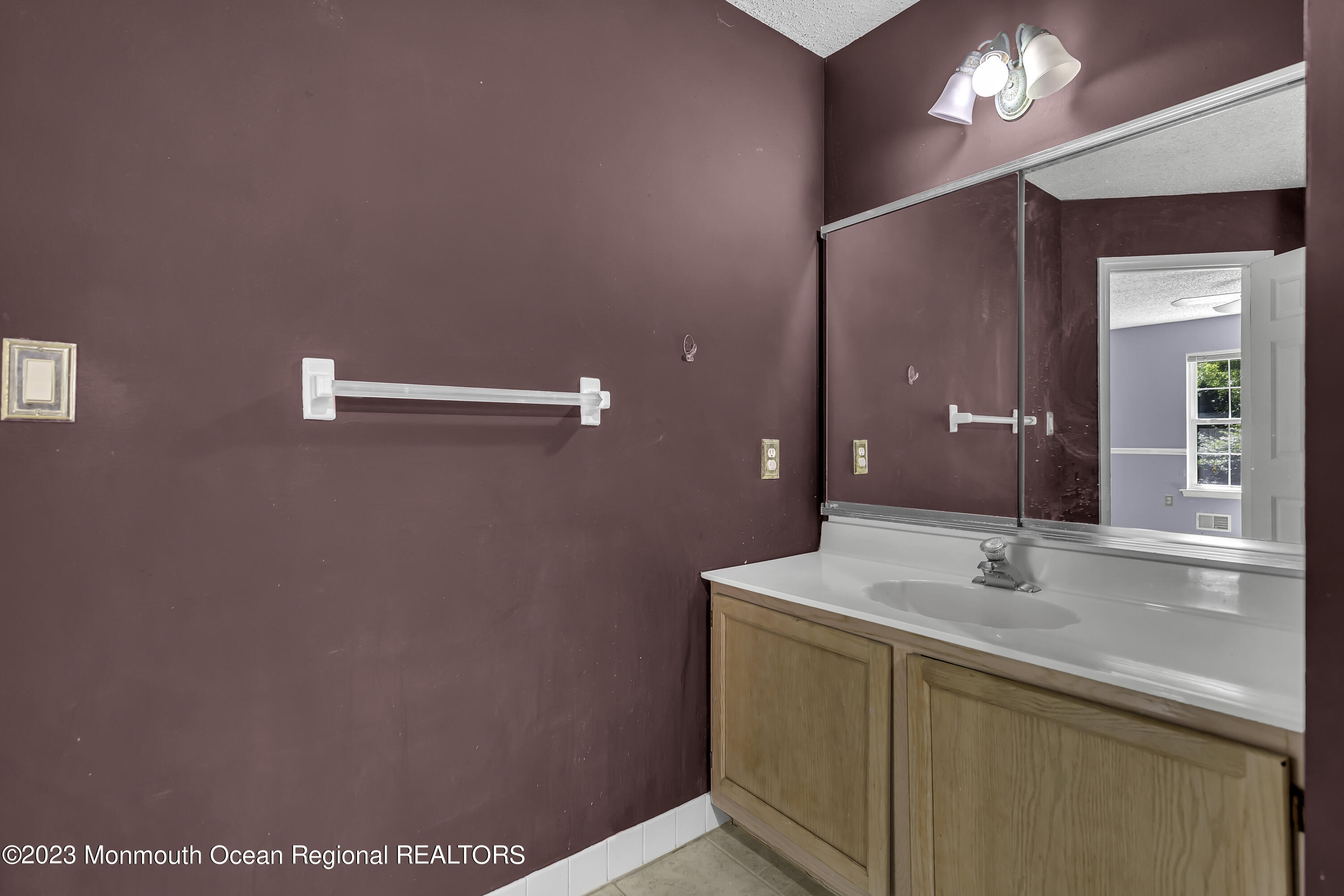 244 Down Hill Run Toms River, NJ 08755 - Photo 28 of 44 a bathroom with a sink a vanity and a mirror