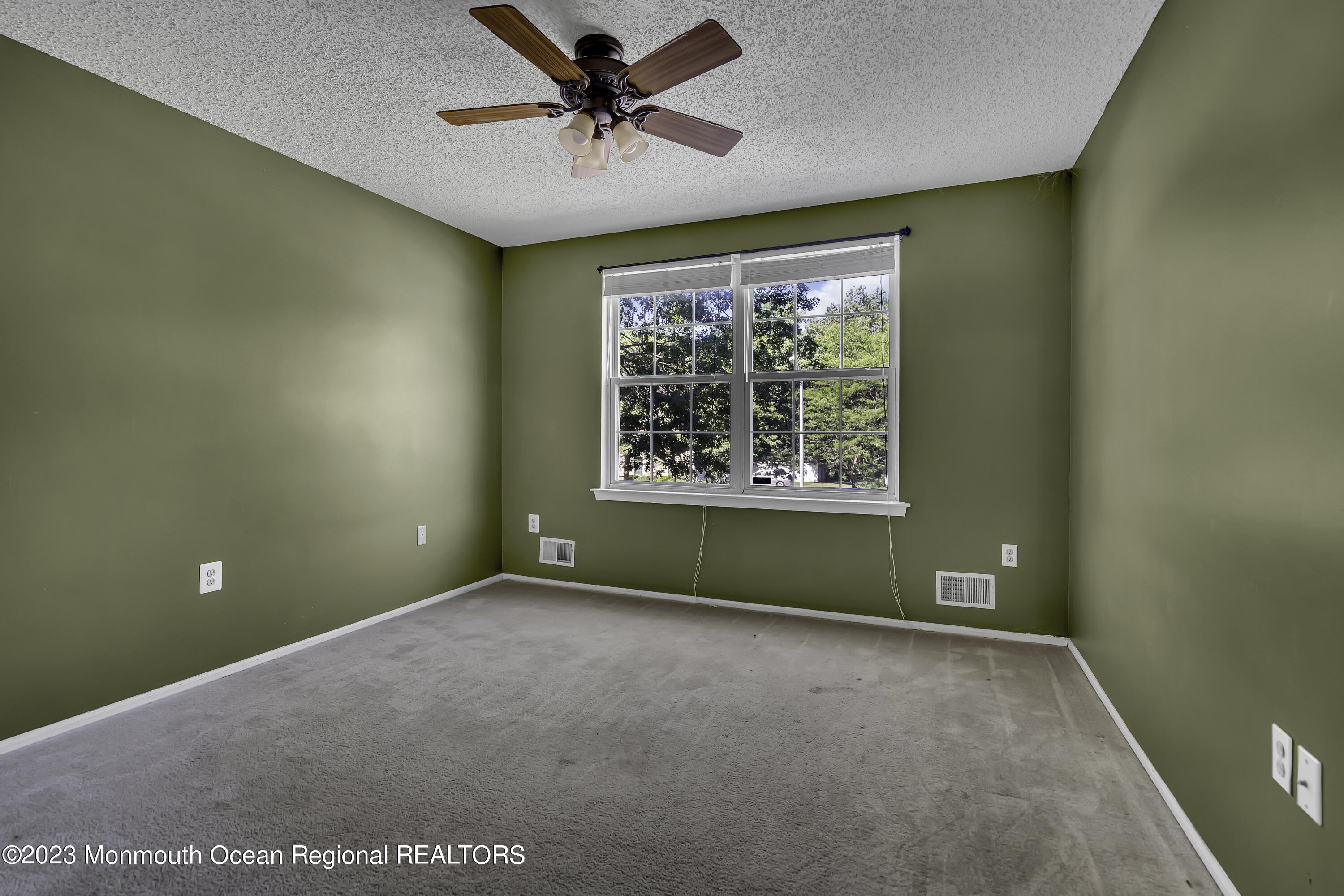 244 Down Hill Run Toms River, NJ 08755 - Photo 34 of 44 an empty room with a window and a ceiling fan