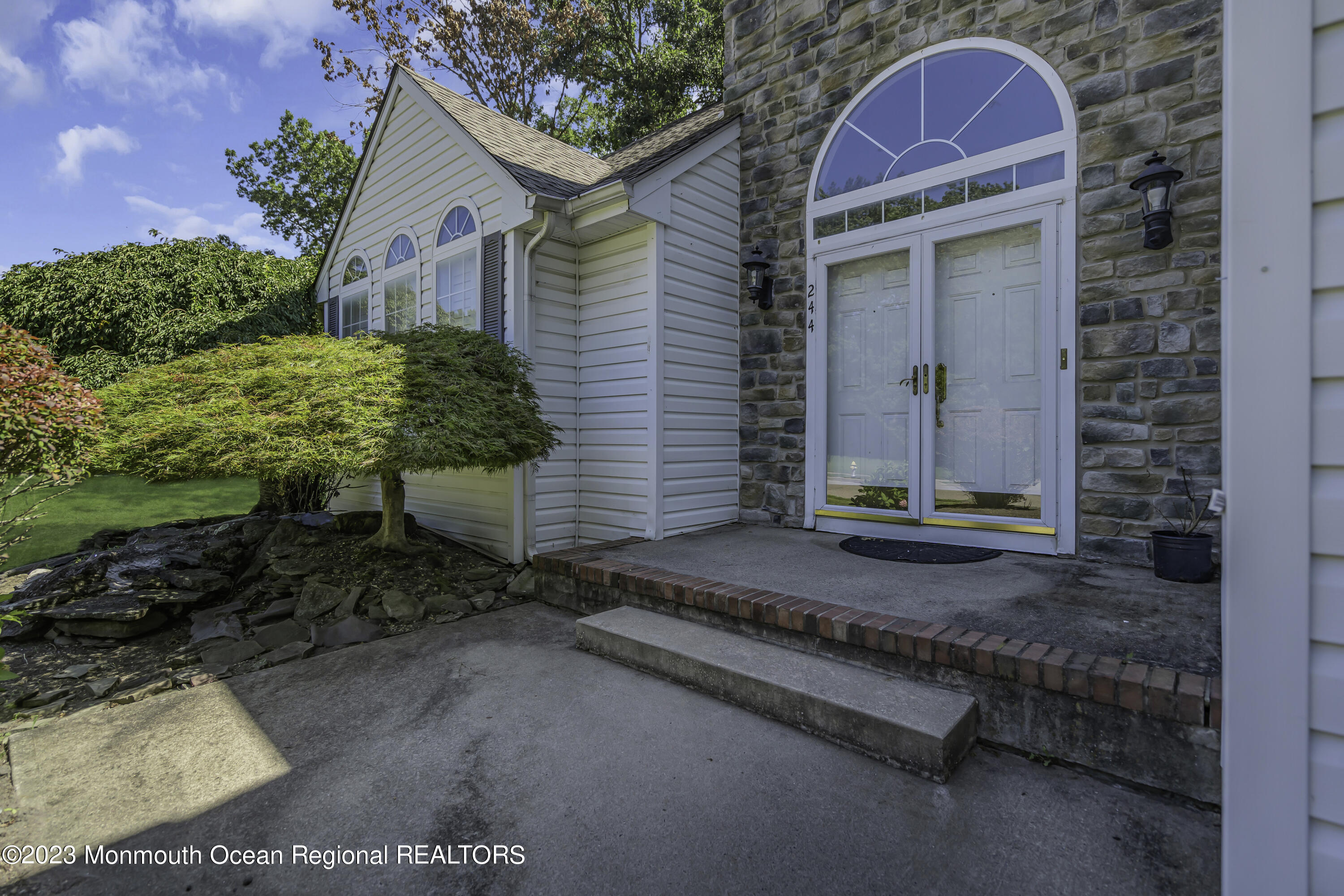 244 Down Hill Run Toms River, NJ 08755 - Photo 8 of 44 a front view of a house with garden