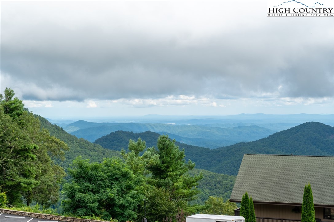 130 Prudden Lane, Unit 103 Blowing Rock, NC 28605 - Photo 14 of 36 a view of a lake in middle of the house