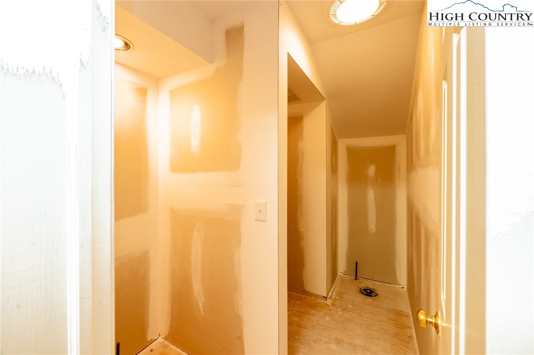 130 Prudden Lane, Unit 103 Blowing Rock, NC 28605 - Photo 17 of 36 a view of a bathroom from a hallway