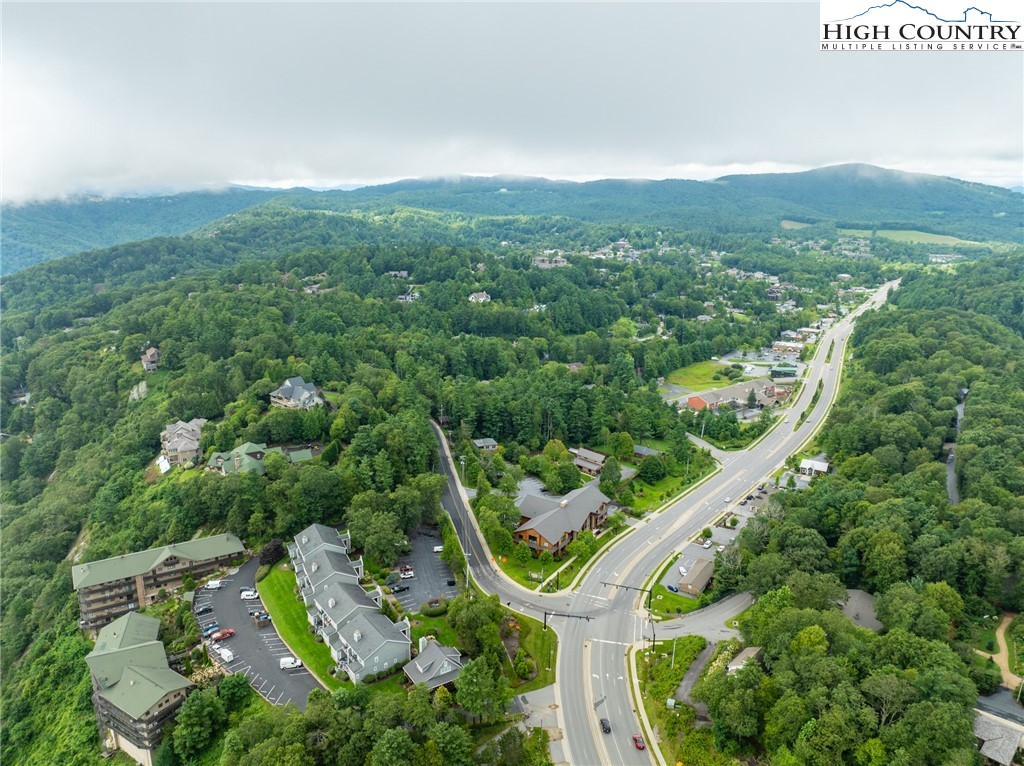 130 Prudden Lane, Unit 103 Blowing Rock, NC 28605 - Photo 2 of 36 an aerial view of a house with a yard