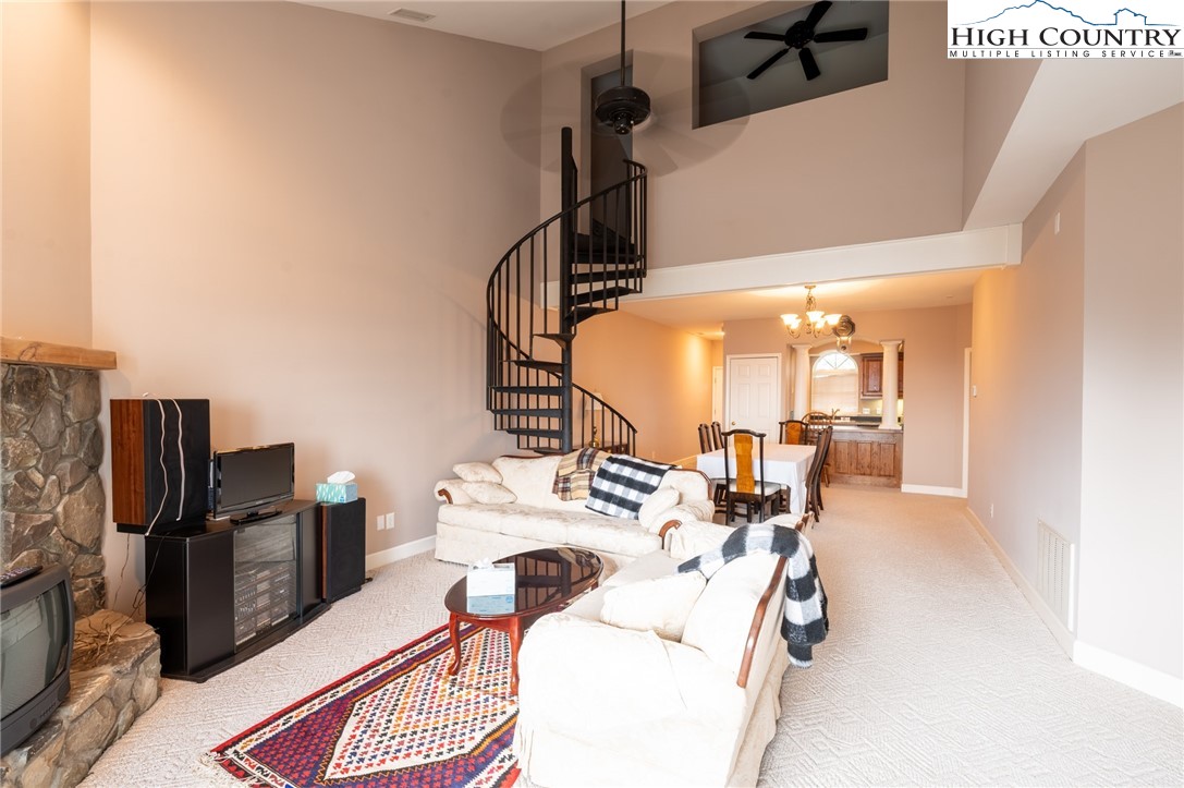 130 Prudden Lane, Unit 103 Blowing Rock, NC 28605 - Photo 24 of 36 a bed room with a bed and a television