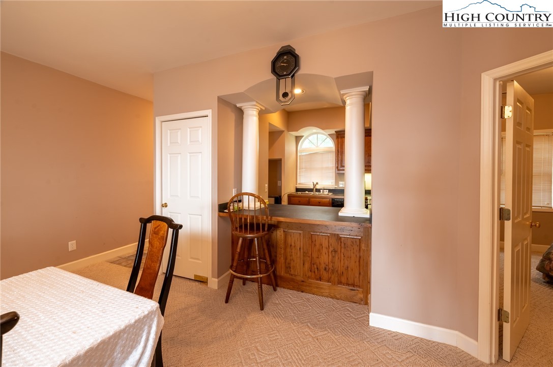 130 Prudden Lane, Unit 103 Blowing Rock, NC 28605 - Photo 30 of 36 a view of a room with a furniture and windows