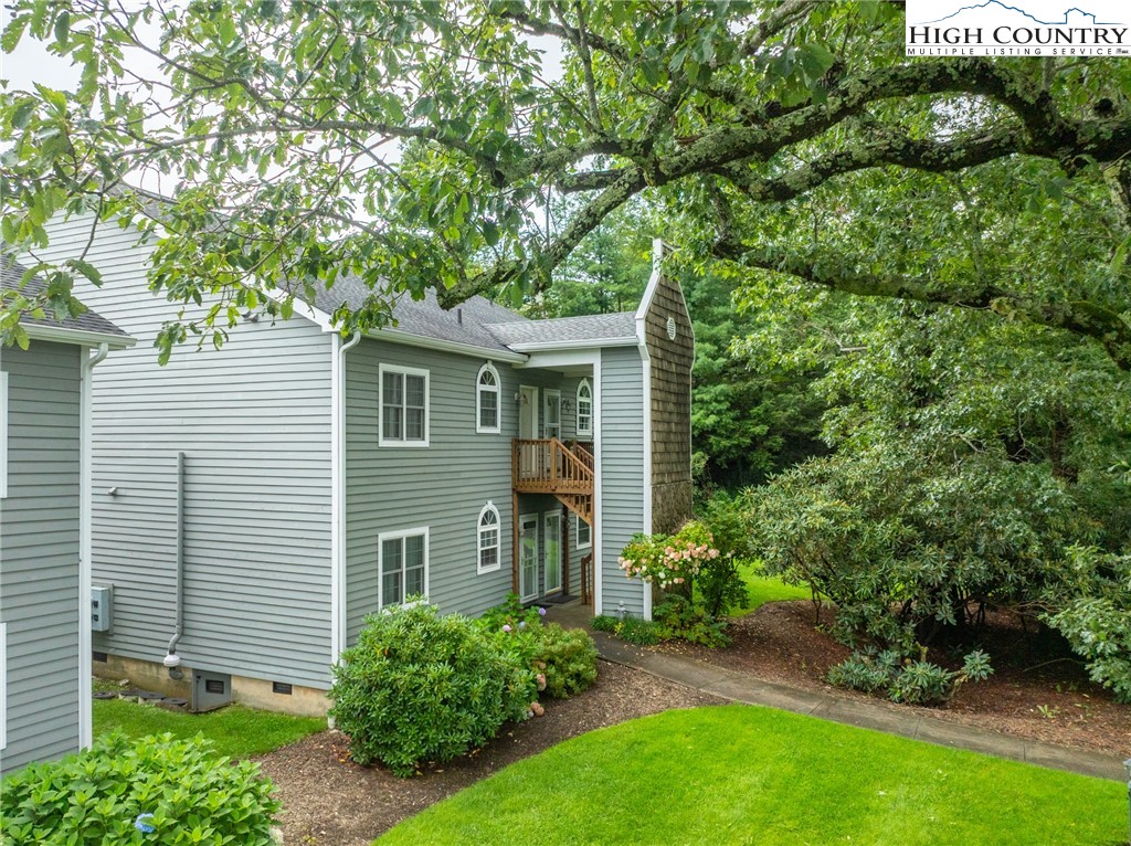 130 Prudden Lane, Unit 103 Blowing Rock, NC 28605 - Photo 35 of 36 a view of a house with a yard