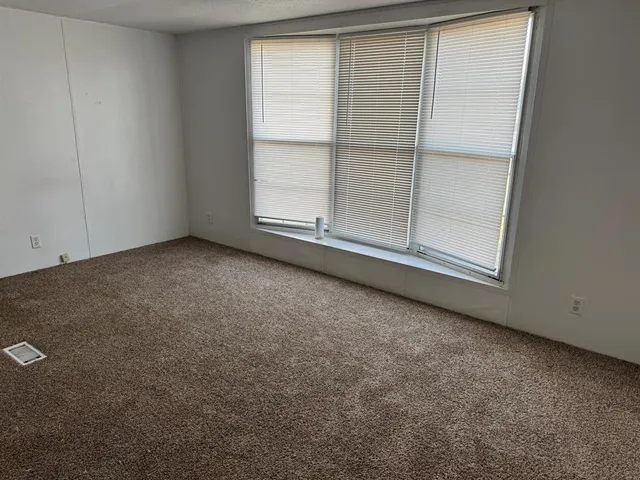 an empty room with window