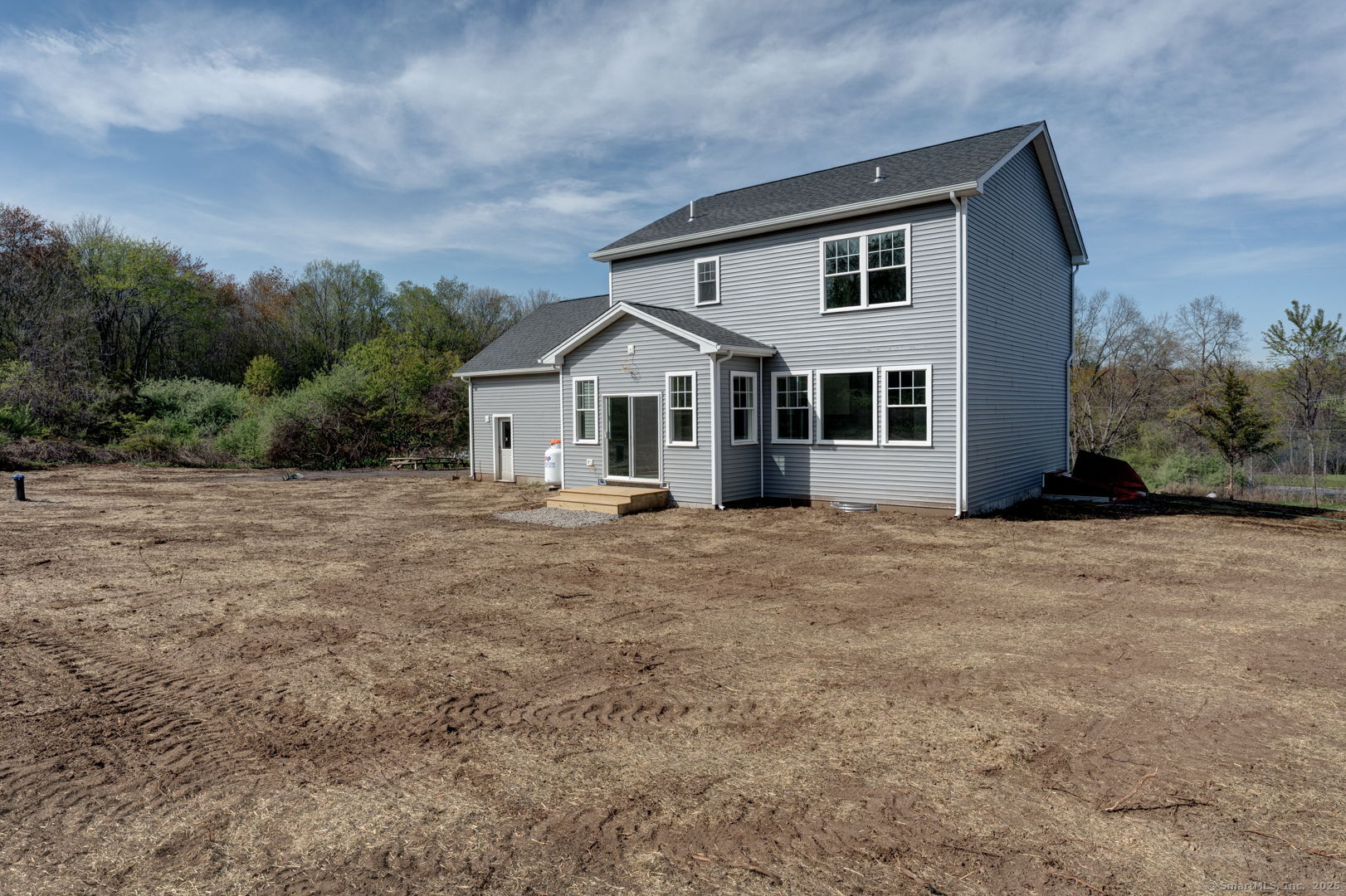 685 Wormwood Hill Road Mansfield, CT 06268 - Photo 3 of 13 a front view of a house with a garden