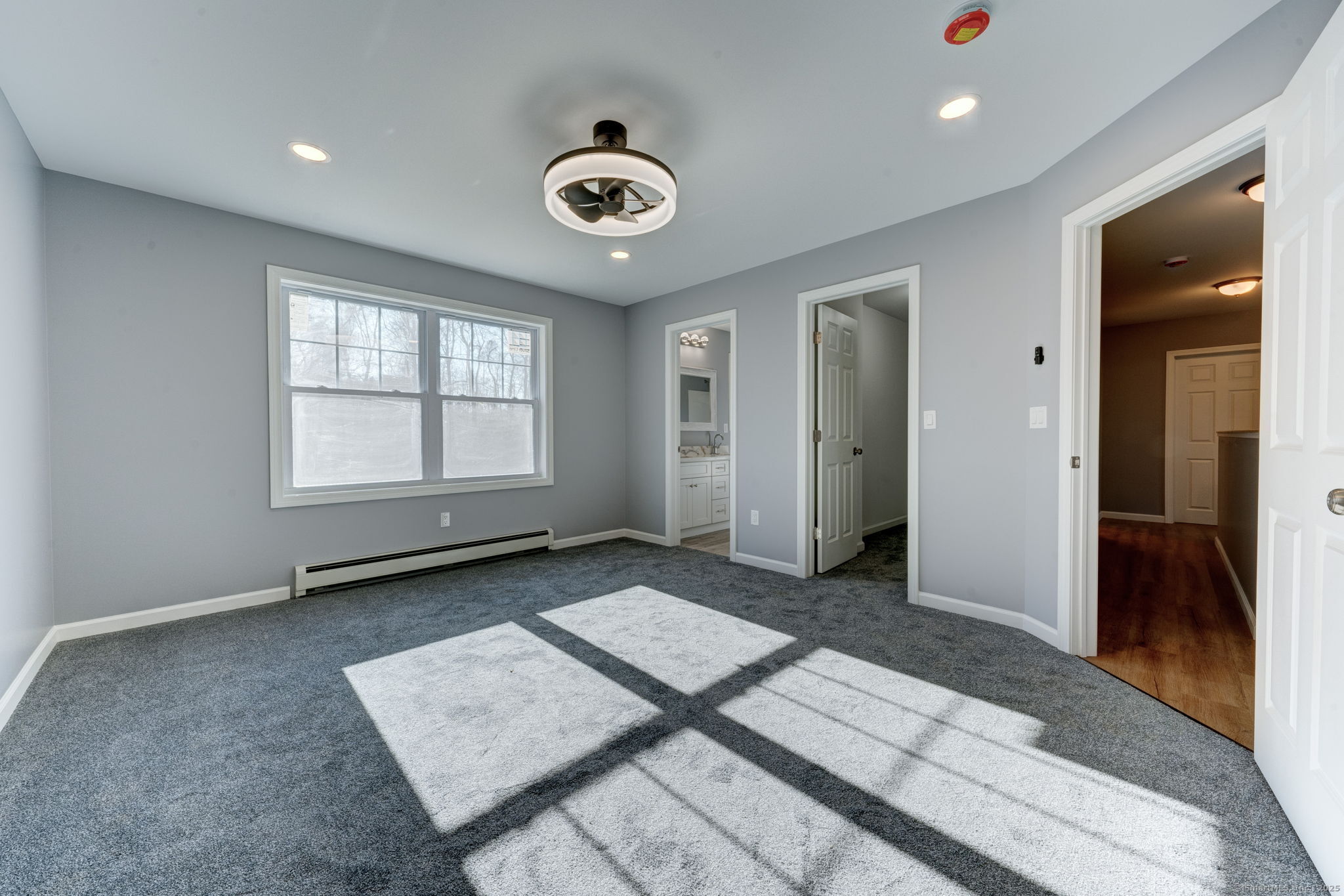 685 Wormwood Hill Road Mansfield, CT 06268 - Photo 10 of 13 an empty room with windows and closet