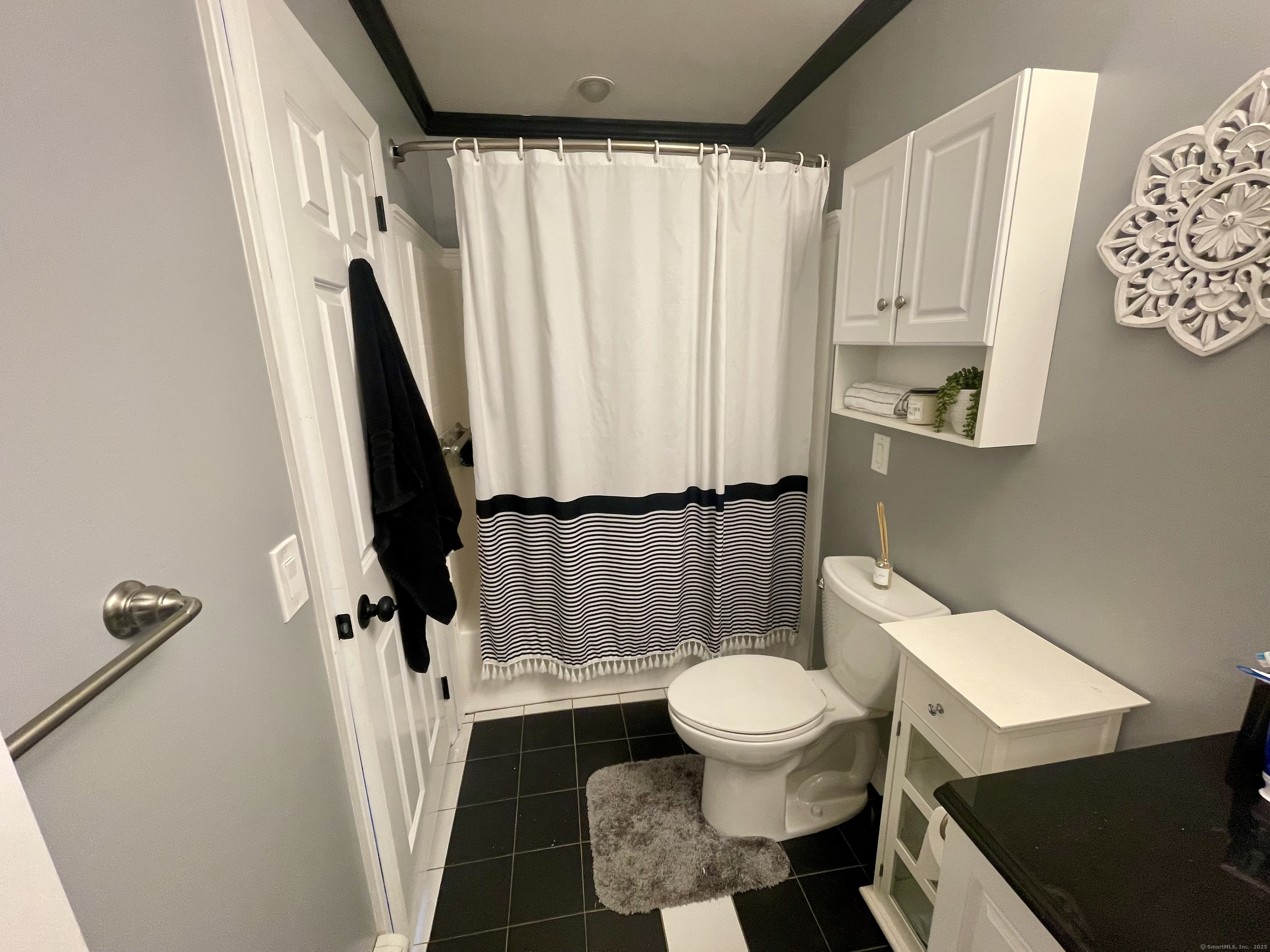 223 Seneca Drive Groton, CT 06340 - Photo 11 of 27 a white toilet sitting next to a small sink