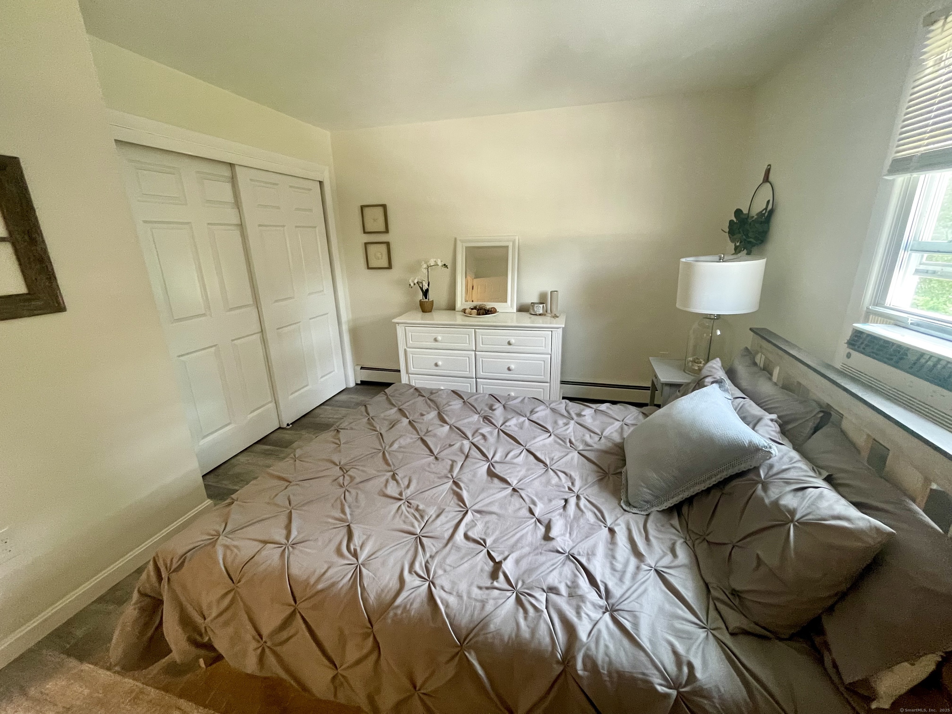 223 Seneca Drive Groton, CT 06340 - Photo 14 of 27 a bedroom with a bed and window