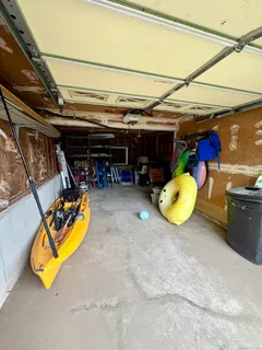a view of a room with wooden furniture