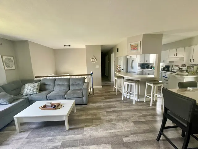 a living room with furniture and a table