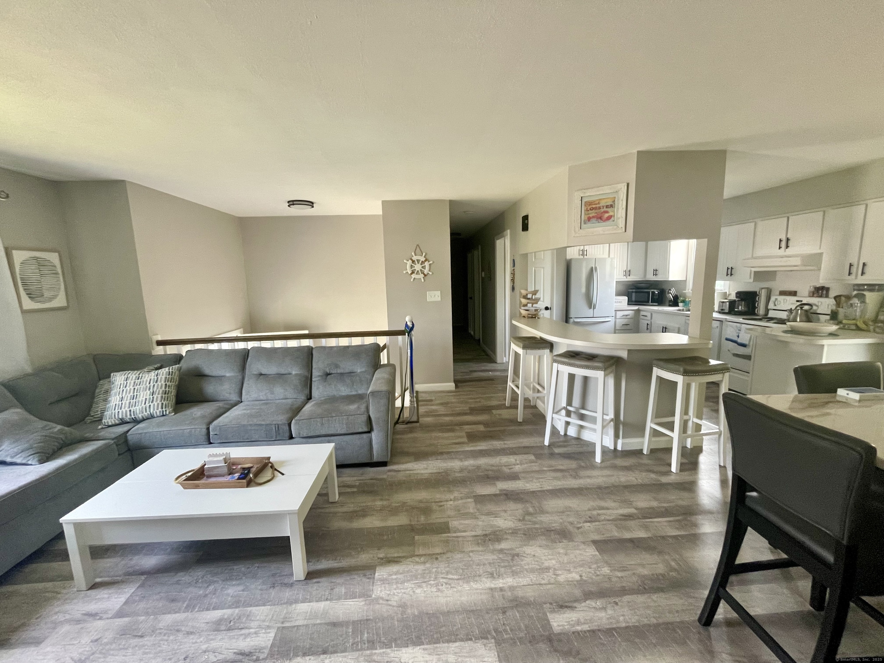 223 Seneca Drive Groton, CT 06340 - Photo 5 of 27 a living room with furniture and a table
