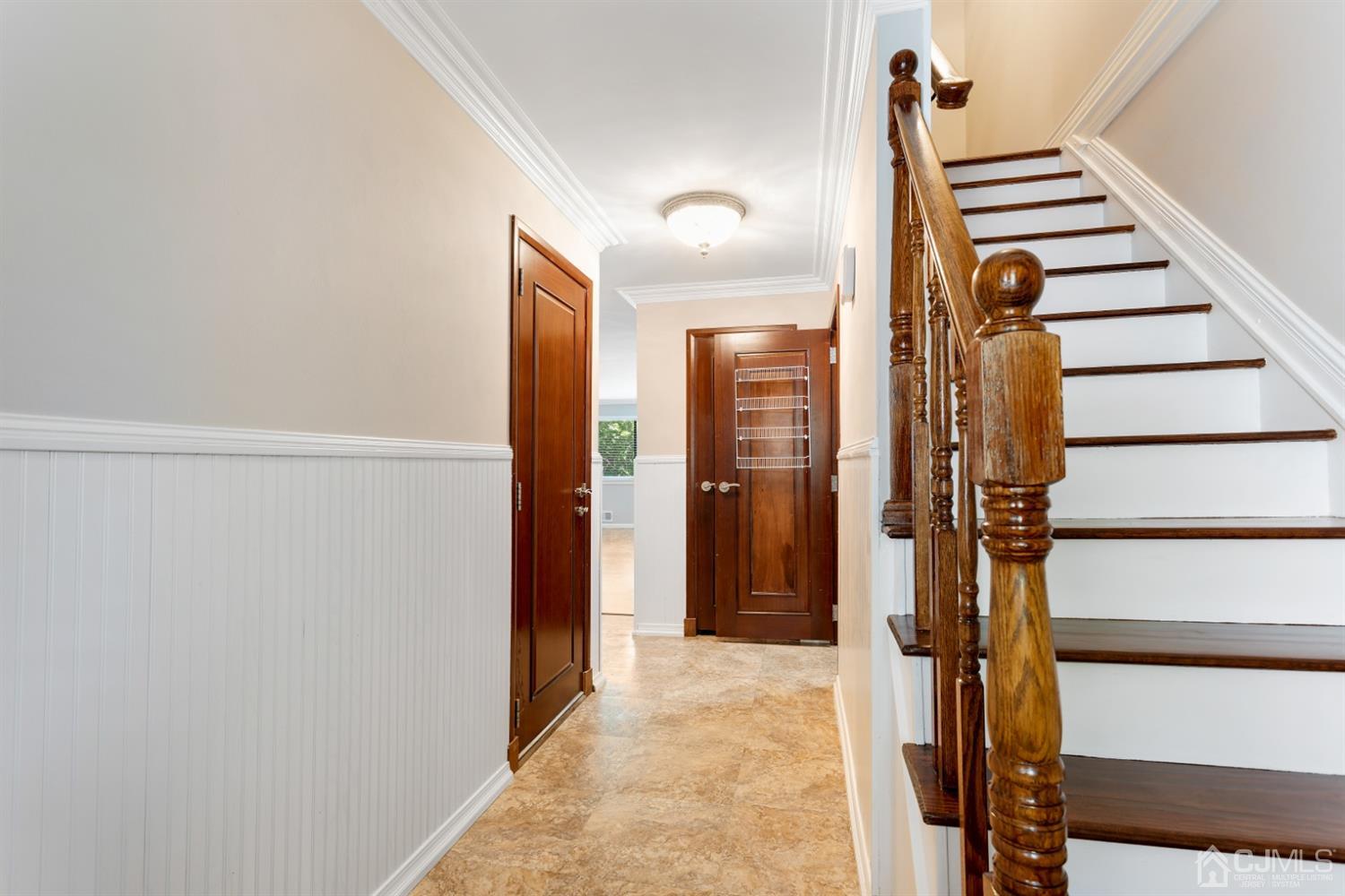 28 Arrowsmith Court Old Bridge, NJ 07747 - Photo 2 of 30 a view of hallway with stairs and wooden floor