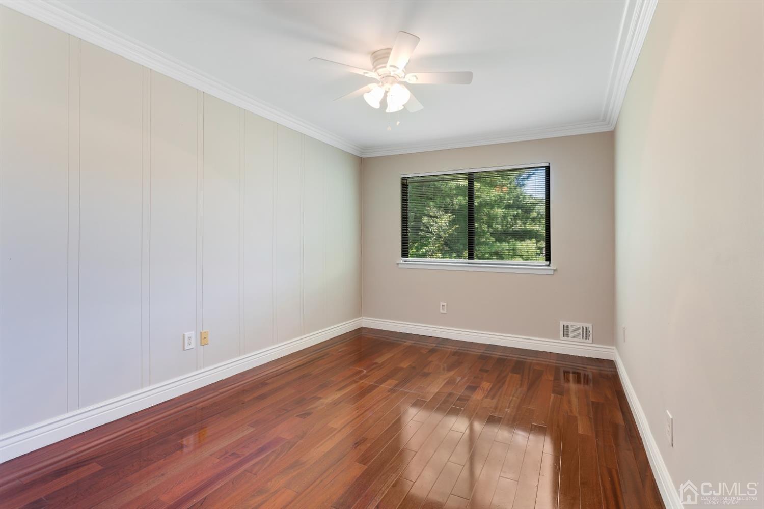 28 Arrowsmith Court Old Bridge, NJ 07747 - Photo 19 of 30 an empty room with a window and a fan