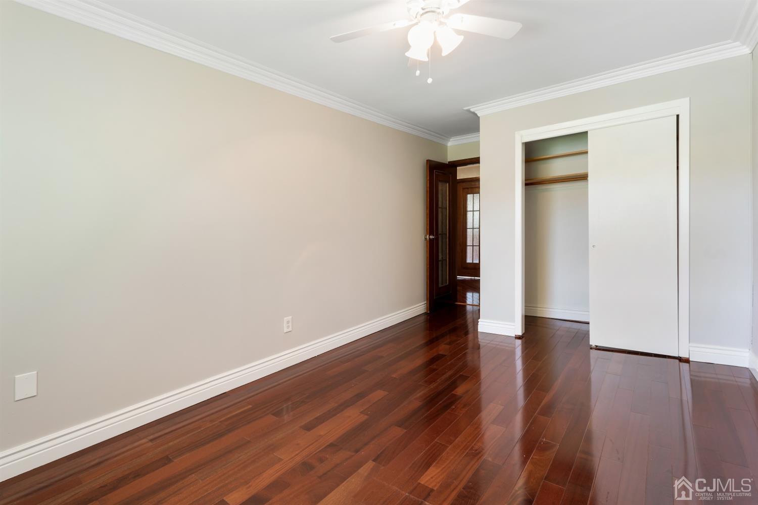 28 Arrowsmith Court Old Bridge, NJ 07747 - Photo 20 of 30 an empty room with wooden floor and closet