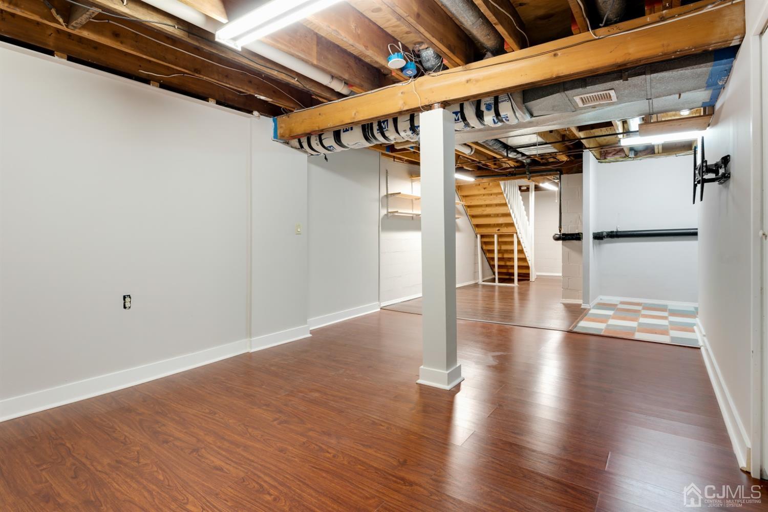 28 Arrowsmith Court Old Bridge, NJ 07747 - Photo 22 of 30 a view of hallway with wooden floor