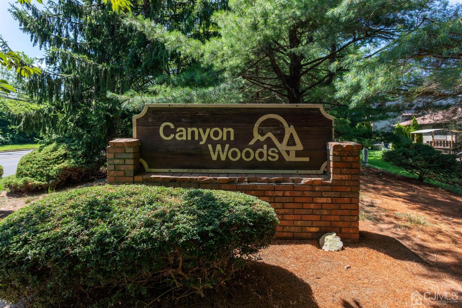 28 Arrowsmith Court Old Bridge, NJ 07747 - Photo 26 of 30 a view of outdoor space with signage and flags