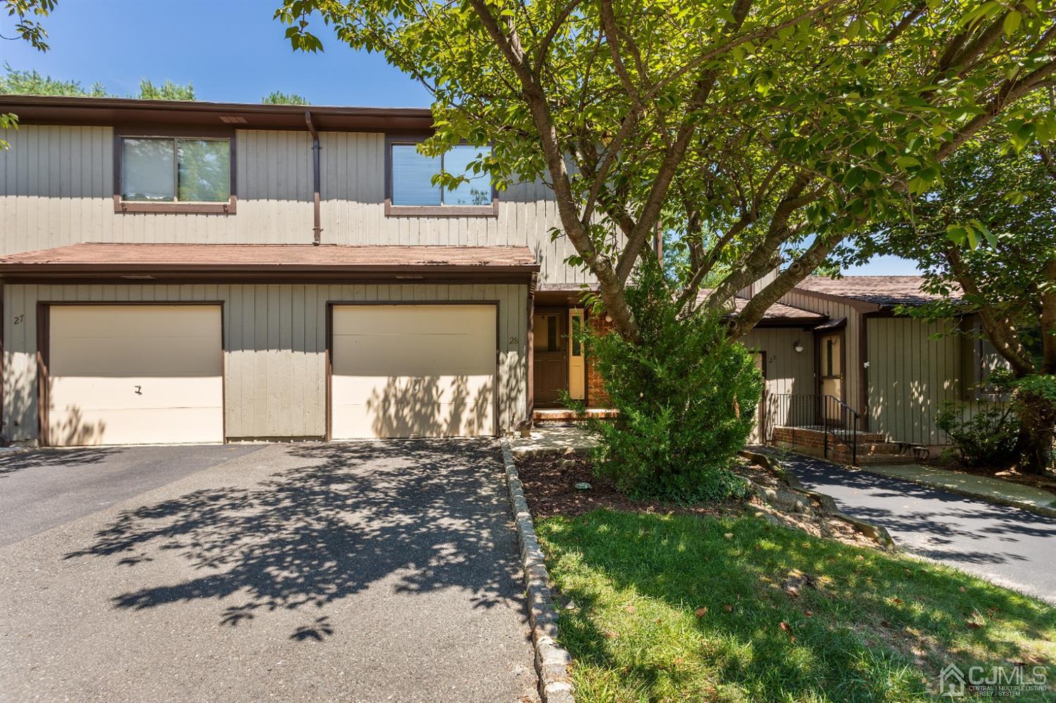 28 Arrowsmith Court Old Bridge, NJ 07747 - Photo 27 of 30 a front view of a house with a garden