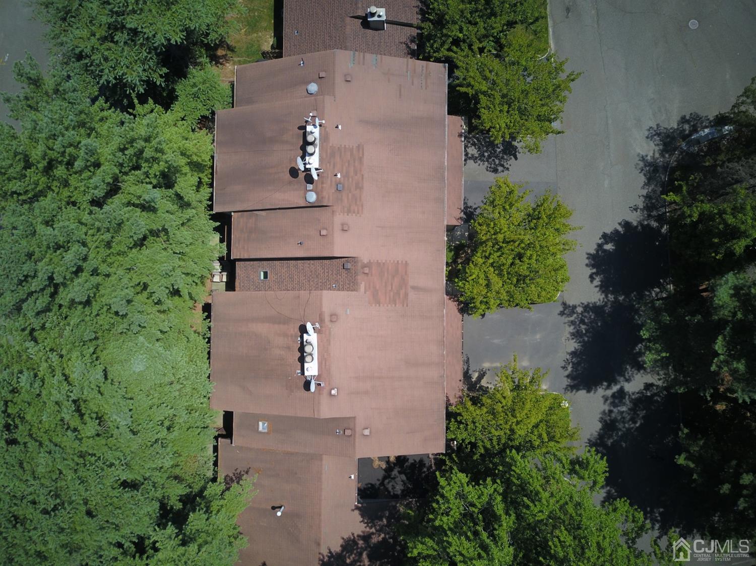28 Arrowsmith Court Old Bridge, NJ 07747 - Photo 28 of 30 an aerial view of a house with outdoor space and trees all around