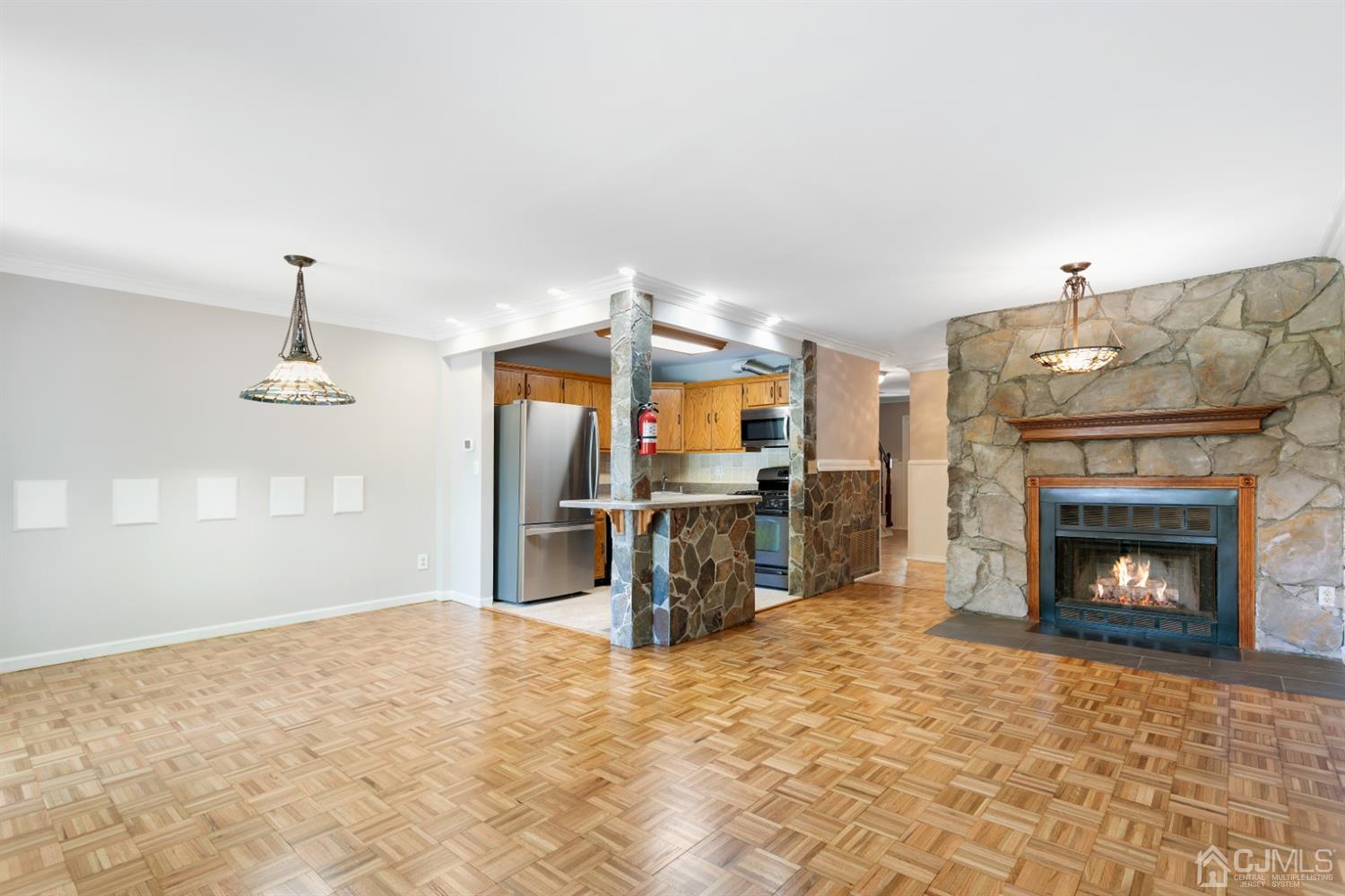 28 Arrowsmith Court Old Bridge, NJ 07747 - Photo 5 of 30 a living room with furniture and a fireplace