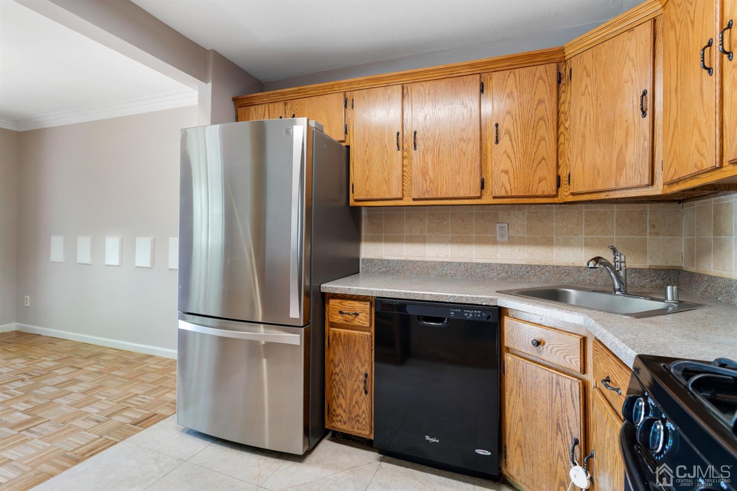 28 Arrowsmith Court Old Bridge, NJ 07747 - Photo 9 of 30 a kitchen with stainless steel appliances granite countertop a refrigerator a sink and a stove