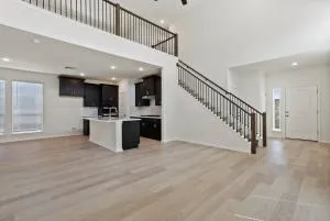a view of an empty room with stairs