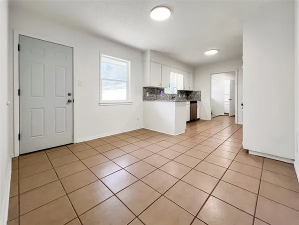 a view of a kitchen with electric appliances