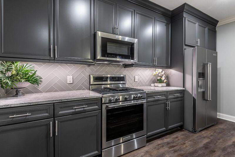 4459 Green Cook Road Johnstown, OH 43031 - Photo 71 of 103 LOWER LEVEL FAMILY ROOM KITCHEN WITH GRANITE TOP, WOODMONT CABINETRY, GLASS TILE BACKSPLASH, KITCHENAID S/S APPLIANCES