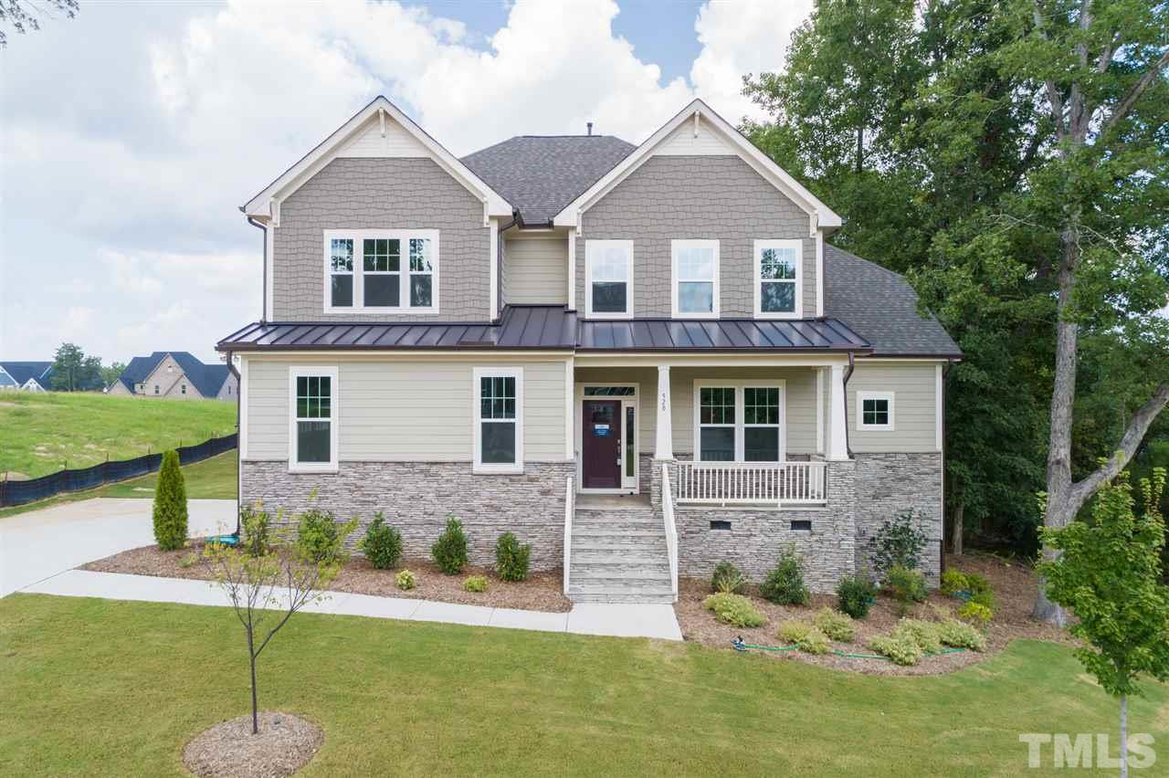 520 Adkins Ridge Road Rolesville, NC 27571 - Photo 1 of 25 a front view of a house with a yard