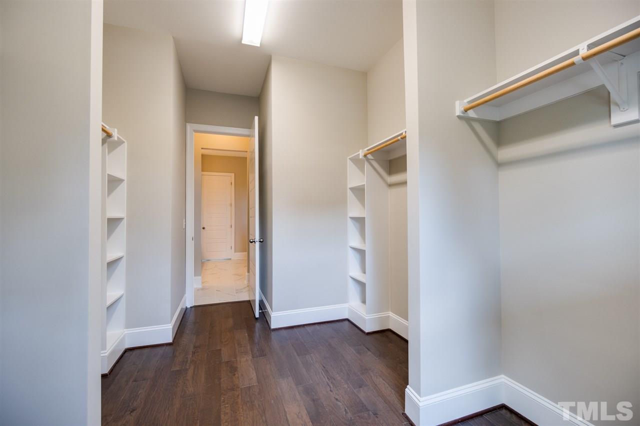520 Adkins Ridge Road Rolesville, NC 27571 - Photo 15 of 25 a view of a hallway with wooden floor and closet