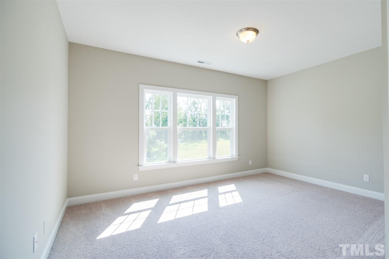 520 Adkins Ridge Road Rolesville, NC 27571 - Photo 16 of 25 an empty room with a window