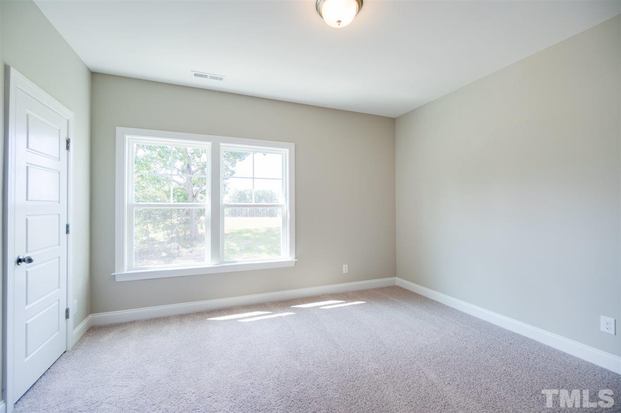 520 Adkins Ridge Road Rolesville, NC 27571 - Photo 18 of 25 an empty room with a window