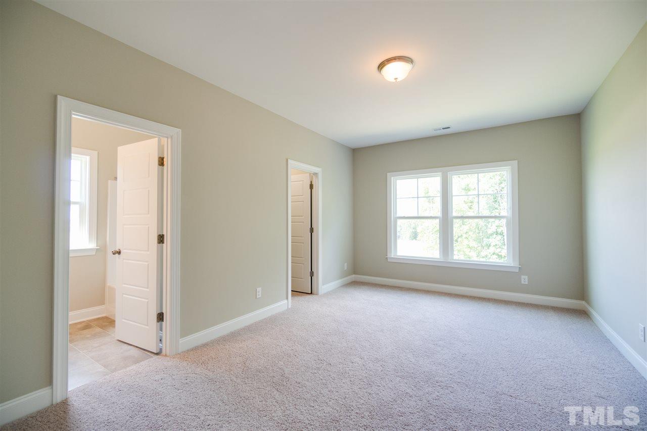 520 Adkins Ridge Road Rolesville, NC 27571 - Photo 19 of 25 a view of an empty room with a window