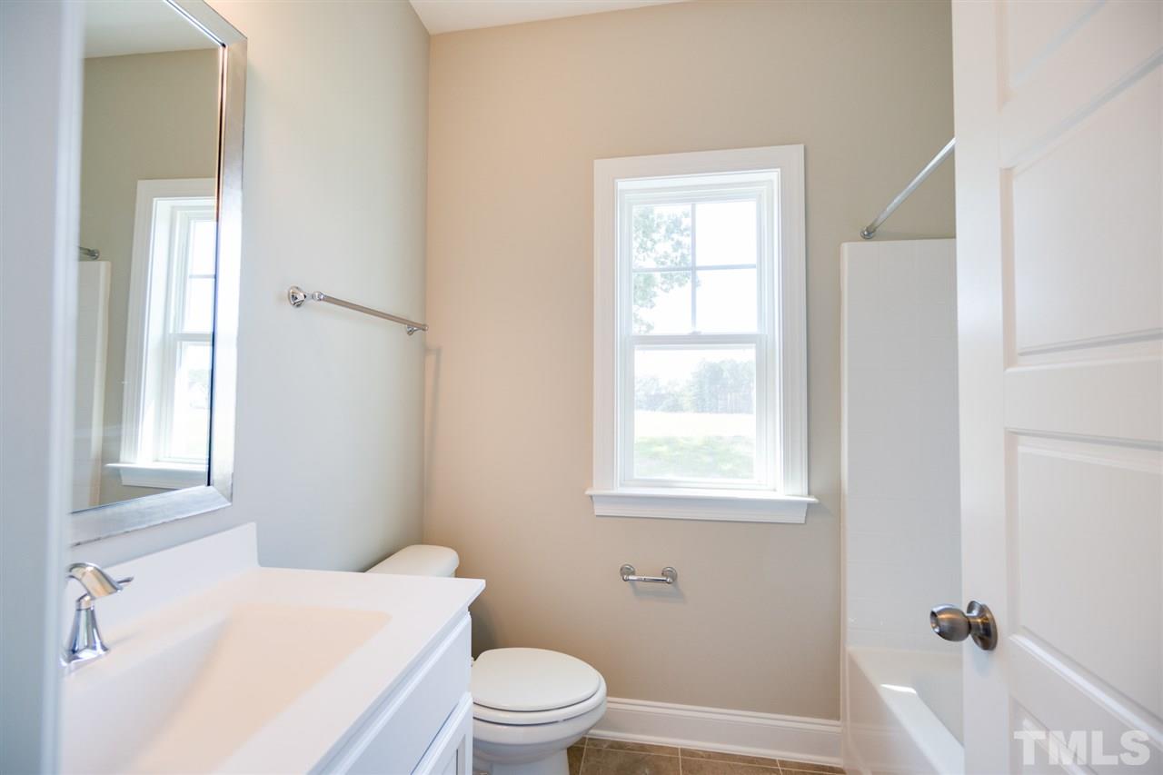 520 Adkins Ridge Road Rolesville, NC 27571 - Photo 20 of 25 a white toilet sitting next to a window