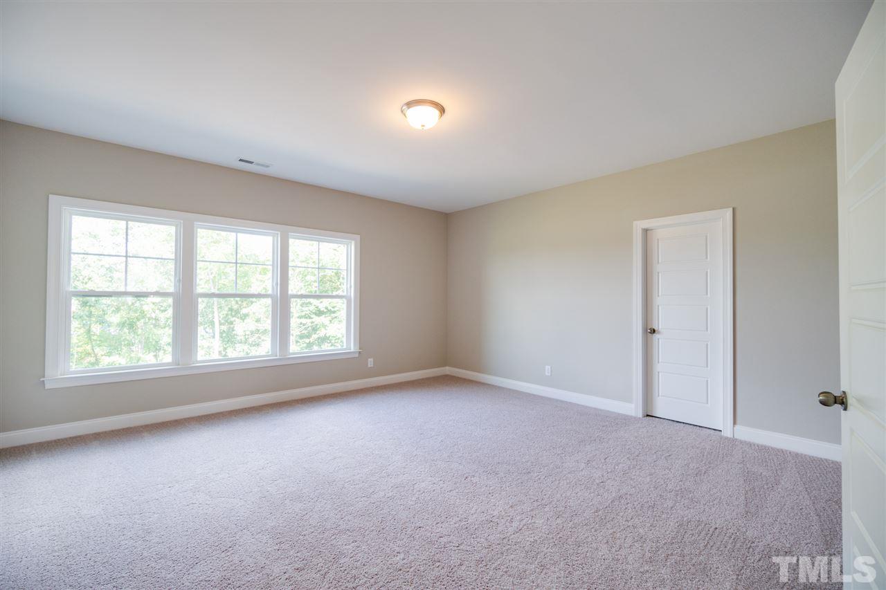 520 Adkins Ridge Road Rolesville, NC 27571 - Photo 22 of 25 an empty room with a window