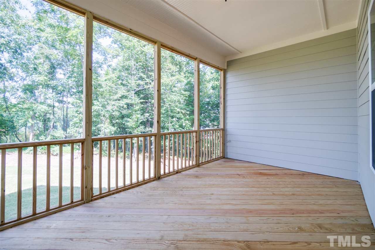 520 Adkins Ridge Road Rolesville, NC 27571 - Photo 24 of 25 a view of a room with wooden floor and large windows