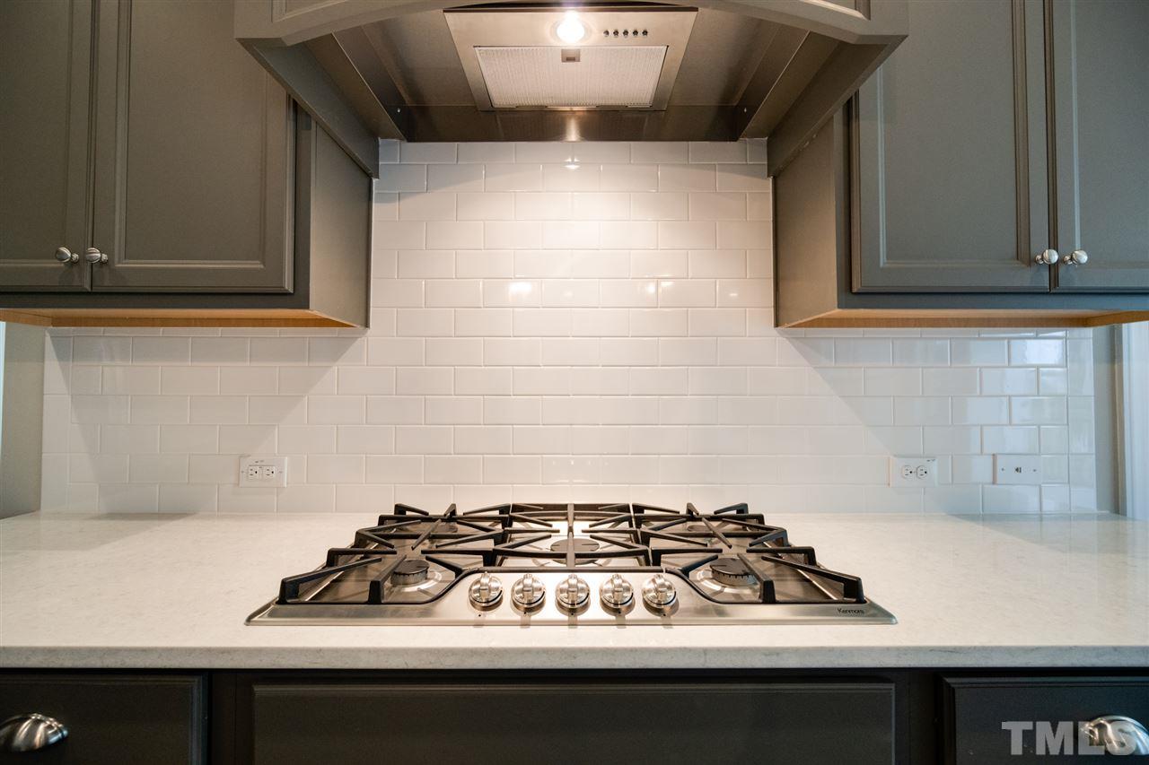 520 Adkins Ridge Road Rolesville, NC 27571 - Photo 9 of 25 a white stove sitting inside of a kitchen