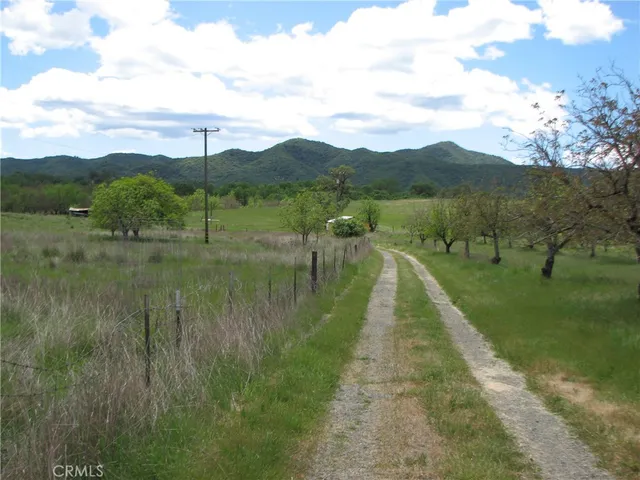 a view of lake with green space