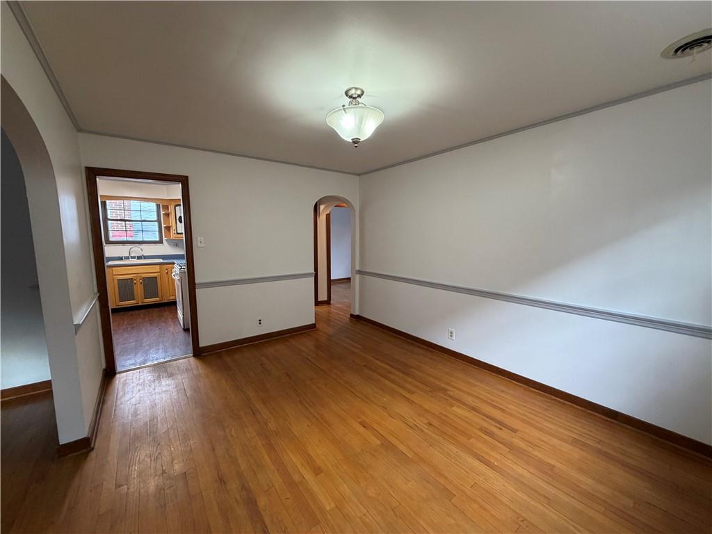 2225 Hampton Street Pittsburgh, PA 15218 - Photo 11 of 36 a view of a livingroom with wooden floor and a ceiling fan